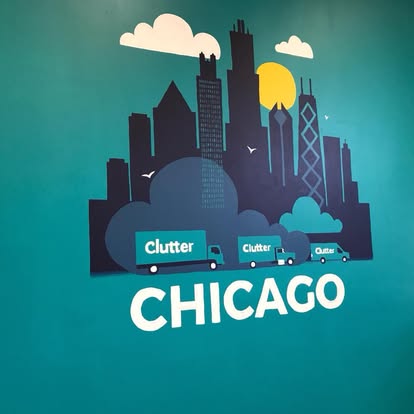 Graphic Chicago skyline illustration in teal, navy, yellow, and white.