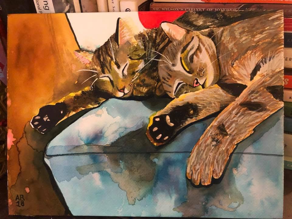 Watercolor portrait of two tabby cats resting together on a blue cushion.